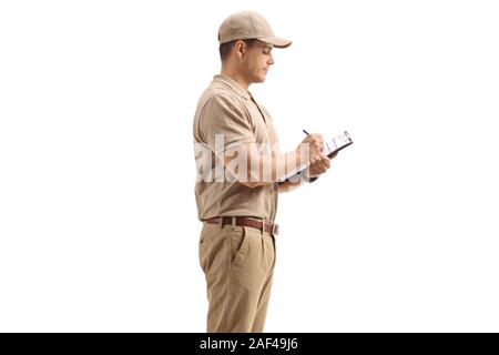 Delivery guy writing in a clipboard isolated on white background Stock Photo