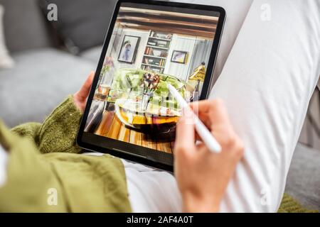 Artist or designer drawing interior sketch using digital tablet and wireless pencil at home, close-up on a screen. Designing on digital touchpads concept Stock Photo
