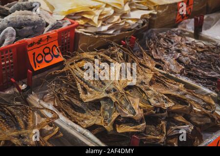 Dried squid and seafood on fish market in Hongkong, China Stock Photo