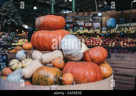 London, UK - November 29, 2019: Variety of pumpkins on sale at Teds Veg stall in Borough Market, one of the largest and oldest food markets in London, Stock Photo