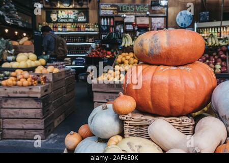 London, UK - November 29, 2019: Variety of pumpkins on sale at Teds Veg stall in Borough Market, one of the largest and oldest food markets in London, Stock Photo