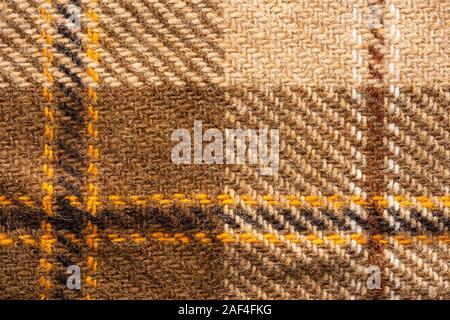 Brown checked fabric. Scottish wool. Fabric for coat plaid suit. Close-up. Background Stock Photo