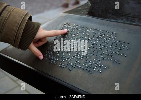 Blind person reading a Braille text. Braille language concept. Stock Photo