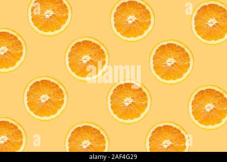 Fruit pattern of orange slices isolated on orange background Stock Photo