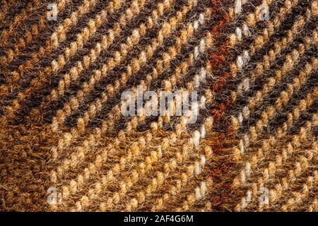 Brown checked fabric. Scottish wool. Fabric for coat plaid suit. Close-up. Background Stock Photo