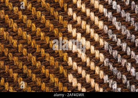 Brown checked fabric. Scottish wool. Fabric for coat plaid suit. Close-up. Background Stock Photo