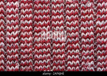 Knitted sweater texture. White and burgundy pattern. Background. Copy space Stock Photo