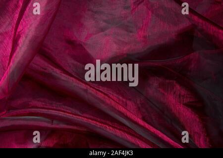 Background fabric folds lilac pink tulle or organza, selective focus Stock Photo