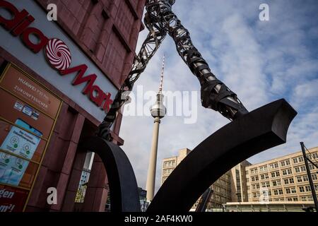 The TV Tower seen through the legs of a sculpture in Berlin, Germany. Stock Photo