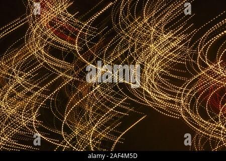 Yellow light trails in curves Stock Photo