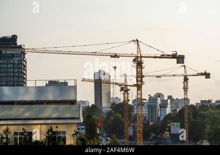 Ho Chi Minh , Vietnam, August 18, 2016 : Large construction site including several cranes working on a building complex, with sky. Stock Photo