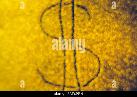 Dollar sign on golden shiny background, blurred Stock Photo