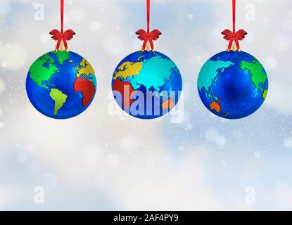 3D illustration of Christmas ornament globe bulb decorations with world maps, each hanging from a red ribbon against a falling snow background. Clippi Stock Photo