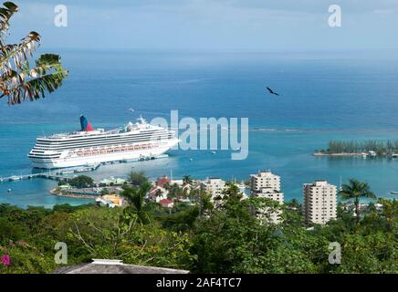 The aerial view of a cruise ship moored in Ocho Rios resort town bay (Jamaica). Stock Photo