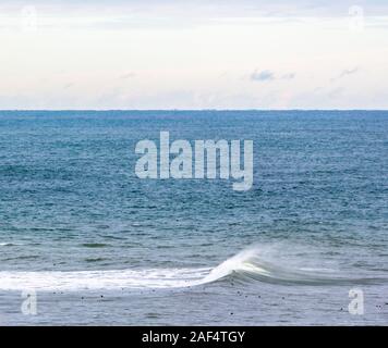 Ocean wave rolling into a Montauk beach, NY Stock Photo