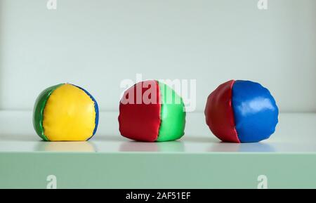 Three colourful juggling balls, isolated on a white background Stock Photo