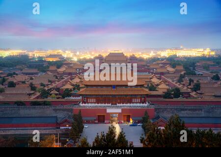 Aerial bird view of the architecture building and decoration of the Forbidden City at night in Beijing, China. Asian tourism, history building, or tra Stock Photo