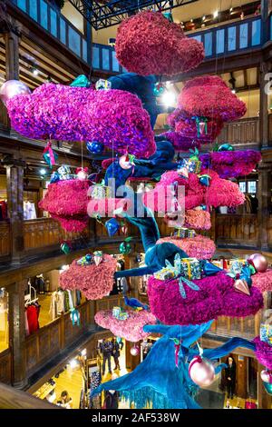 A large Christmas tree in a Japanese bonsai style made of reindeer moss suspended from the ceiling at Liberty London, UK Stock Photo