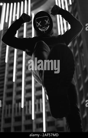 Travel portrait of man wearing hoodie with face hidden looking towards the  mountains Stock Photo - Alamy