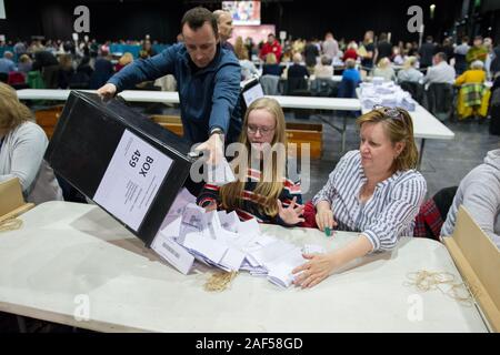 Glasgow, UK. 12 December 2019.Pictured: Votes arriving and being processed into piles. Scenes from the vote count at the Scottish Exhibition and Conference Centre (SECC). The poles have now closed at 10pm and the vote count is now underway for the UK Parliamentary General Election 2019. This is the first time in almost 100 years that a general election has taken place in December. Credit: Colin Fisher/Alamy Live News. Stock Photo