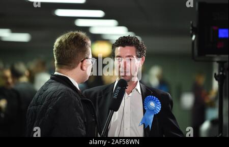 Brighton UK 12th 2019 - Robert Nemeth  the prospective Conservative candidate for Hove speaks to the media as counting takes place for the Brighton Pavilion , Hove and Brighton Kemptown constituencies in the General Election vote being held in The Brighton Centre this evening  : Credit Simon Dack / Alamy Live News Stock Photo