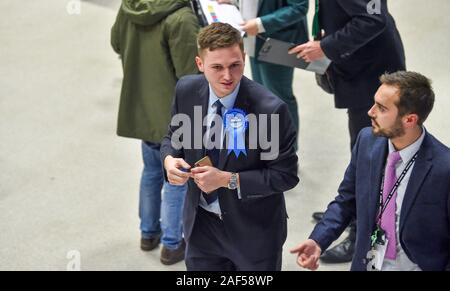 Brighton UK 12th 2019 -  Joe Miller the prospective Conservative candidate for Brighton Pavilion watches as the counting begins for the Brighton Pavilion , Hove and Brighton Kemptown constituencies in the General Election vote being held in The Brighton Centre this evening  : Credit Simon Dack / Alamy Live News
