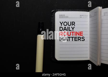 Your Daily Routine Matters. write on a book isolated on office desk Stock Photo