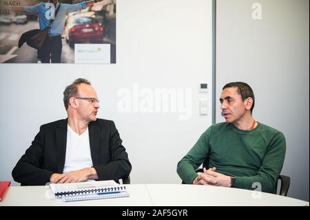 Mainz, Germany. 27th Nov, 2019. Sean Marett (l), CFO BioNTech, and Ugur Sahin, CEO BioNTech, sit next to each other during the interview. BioNTech is a biotechnology company focused on developing and manufacturing a patient-specific approach for the treatment of cancer and other serious diseases. Credit: Andreas Arnold/dpa/Alamy Live News Stock Photo