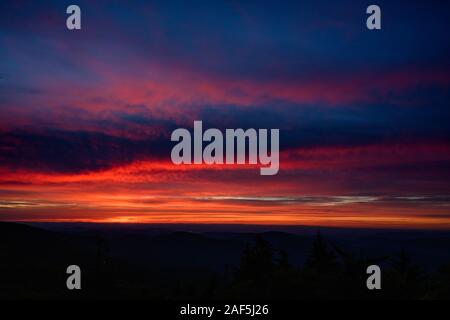Deep Oranges Pinks and Blues in Sunset over Blue Ridge mountains Stock Photo