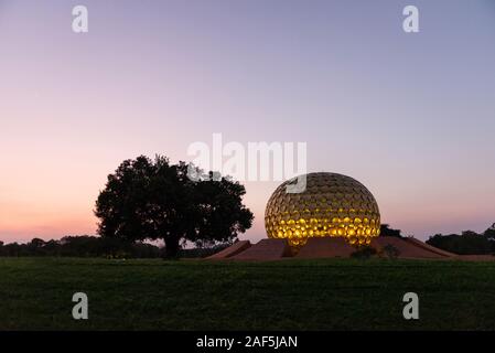 AUROVILLE, INDIA - December 2019: The Matrimandir at sunset Stock Photo