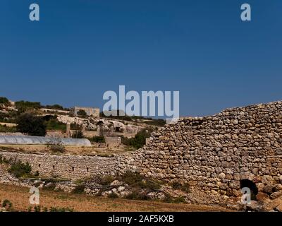 An old and neglected historic Roman wall on the island of Malta Stock Photo