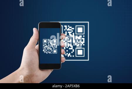 QR code scanning payment and verification. Hand using mobile smart phone scan QR code Stock Photo