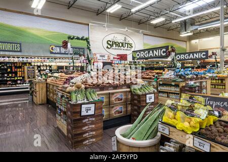 view of attractively displayed bountiful produce area in upscale Sprouts Farmers Market Tucson Arizona with organic indicated by large hanging signs Stock Photo