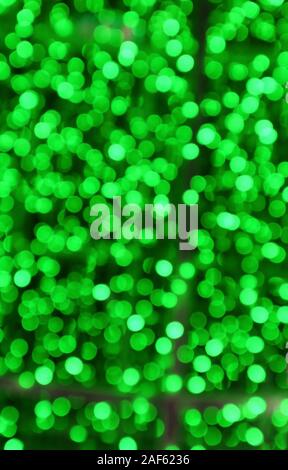 Vertical Image of Abstract Blurred Illuminated Green Lights Stock Photo