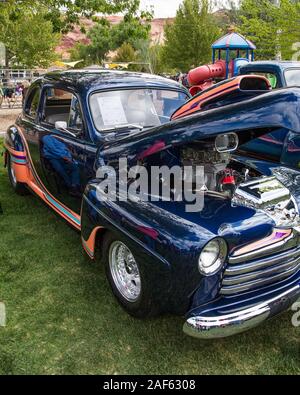 A restored and modified 1947 Ford Deluxe Coupe with a supercharged V-8 engine in the Moab April Action Car Show in Moab, Utah. Stock Photo