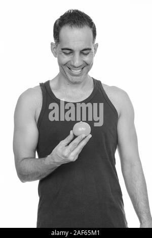 Mature happy Persian man holding Coca-cola zero drink Stock Photo - Alamy
