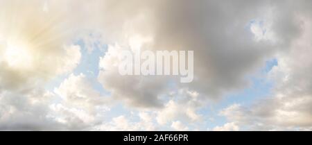 Clear blue sky with clouds and sun. Stock Photo
