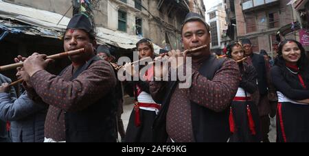 Kathmandu, Nepal. 12th Dec, 2019. People from Newar community play traditional music as they participate in a rally organized in celebration of Yomari Punhi festival and Jyapu Day in Kathmandu. Yomari Punhi is a Newari festival marking the end of the rice harvest which takes place in November/December during the full moon day. A yomari is a confection of rice flour (from the new harvest) dough shaped like fish and filled with brown cane sugar and sesame seeds, which is then steamed. (Photo by Archana Shrestha/Pacific Press) Credit: Pacific Press Agency/Alamy Live News Stock Photo