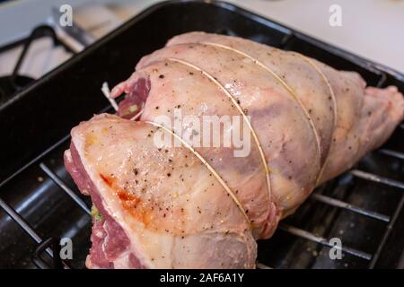 Leg of lamb stuffed and trussed in preparation for roasting Stock Photo