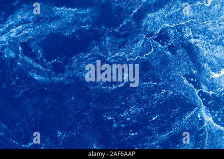 Abstract marble background. Backdrop in blue colors. Texture of marble surface great for design. The main color trend of 2020 year. Stock Photo