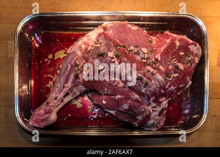 Lamb leg seasoned for frying in a Metal Casserole, Mecklenburg-Western Pomerania, Germany Stock Photo