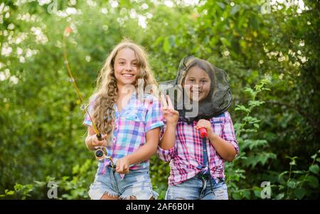 Having fun. Fly fishing. Kids spend time together fishing. Fishing skills.  Adorable girls nature background. Teamwork. Summer hobby. Happy smiling  children with net and rod. Happy childhood Stock Photo - Alamy