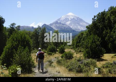 Tourist hikes in front of Lanin Volcano, Lanin National Park, Neuquen Province, Argentina Stock Photo