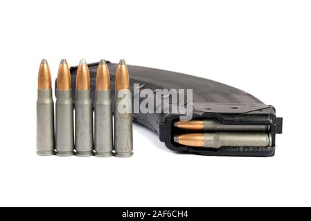 Old rifle bullet and magazine (cassette) isolated on white background Stock Photo