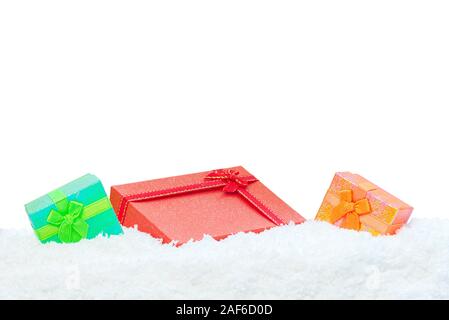 Three gift boxes in snow white background Stock Photo