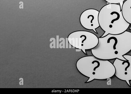 Question marks on speech bubbles side border Stock Photo