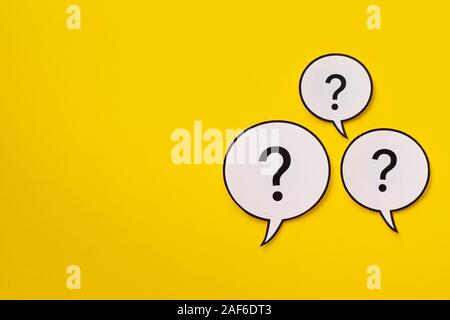 Three speech bubbles with question marks with copy space Stock Photo