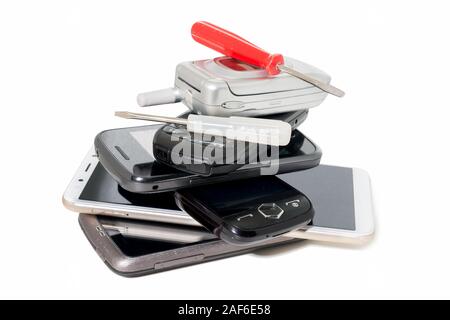 Repair of six black phones and two screwdrivers isolated white background Stock Photo