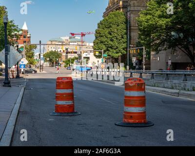 Columbus, Ohio - August 3, 2019:  Construction barrels for road work on a street in Columbus, Ohio on August 3, 2019. Stock Photo