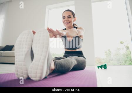 Full body close up photo of beauty sport athlete girl have own morning regime doing activity sport yoga aerobics exercise stretch hands touch fingers Stock Photo